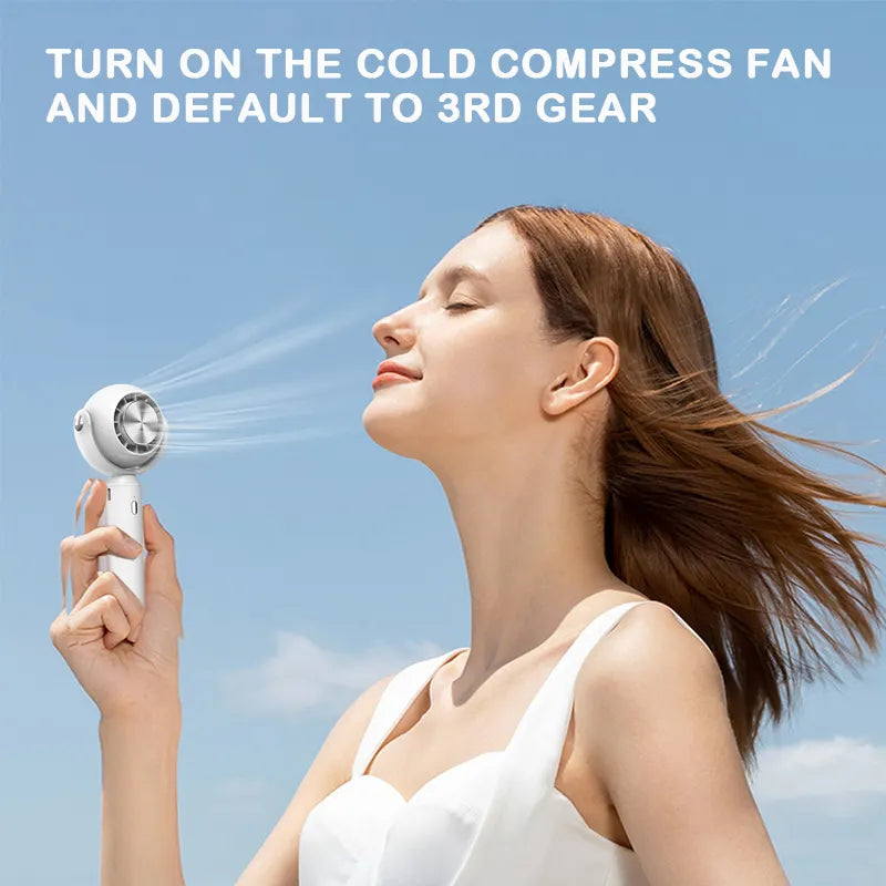 Hot Sale Handheld Semiconductor Refrigeration Mini Fan Portable Rechargeable Cold Compress Hand Held Fan